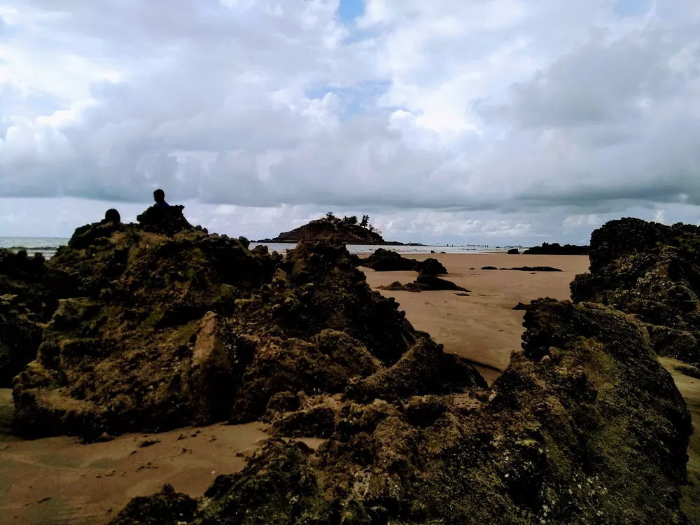 Dark rocks and sand on Back Beach near Hòn Bà, Vũng Tàu