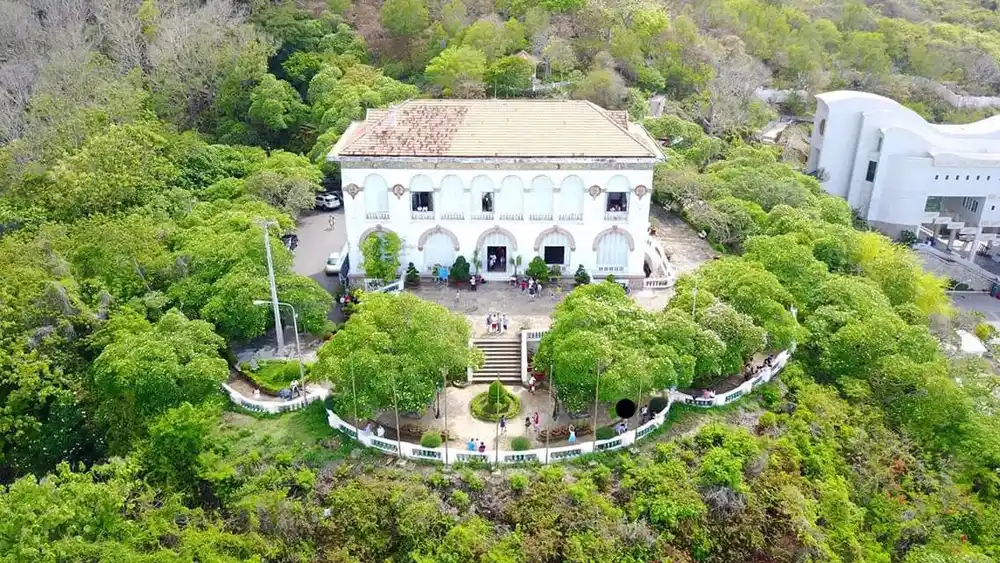 Aerial view of Bạch Dinh surrounded by trees in Vũng Tàu