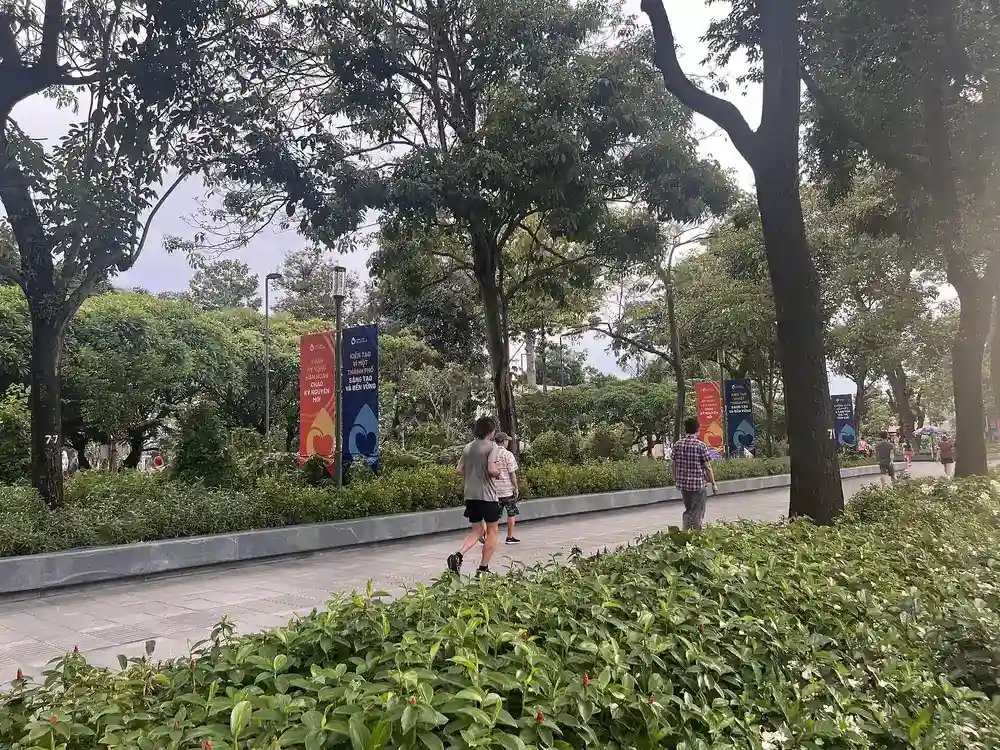 Tree-lined walkway in a park in central Ho Chi Minh City