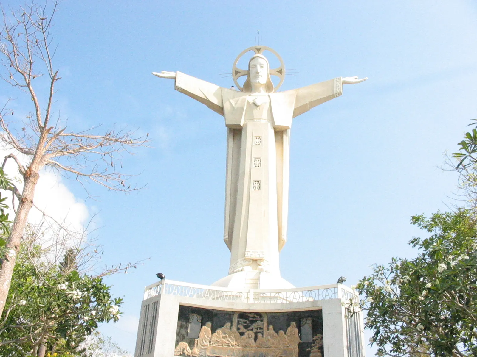 Christ the King statue on Núi Nhỏ, Vũng Tàu, against a blue sky