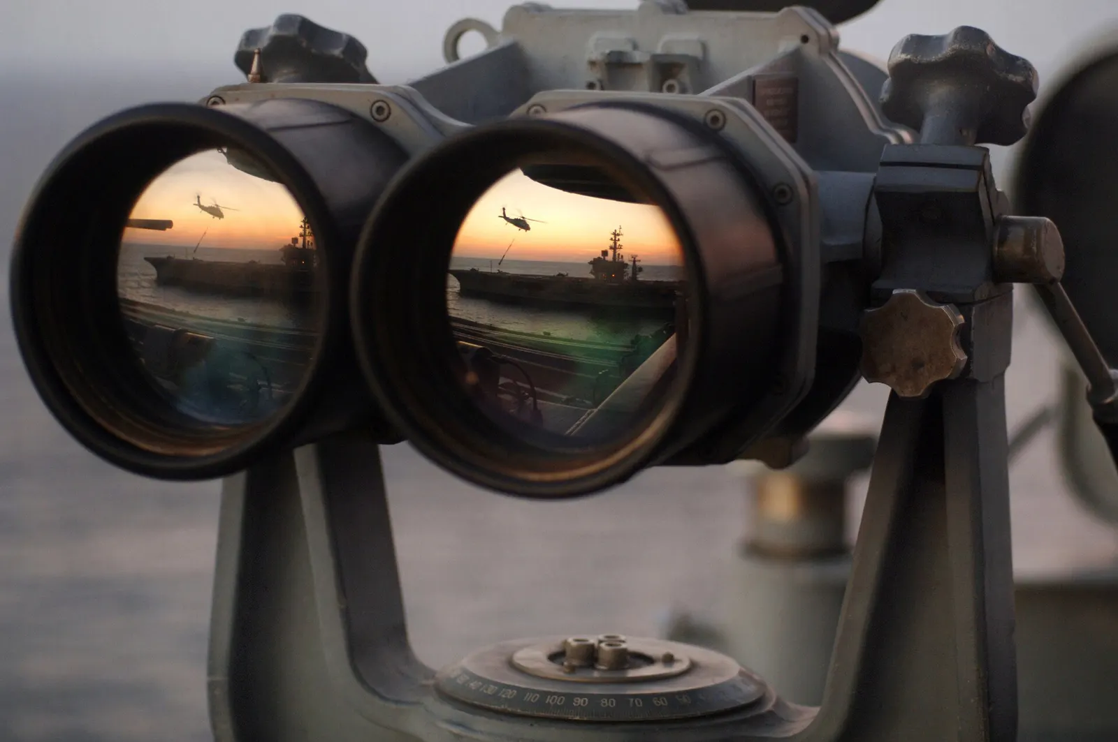 Large mounted binoculars at sunset