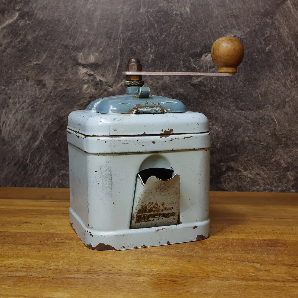 Old metal hand coffee grinder