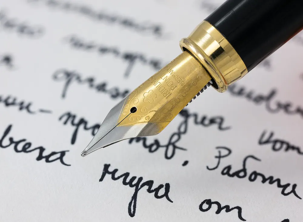 Fountain pen writing on lined paper