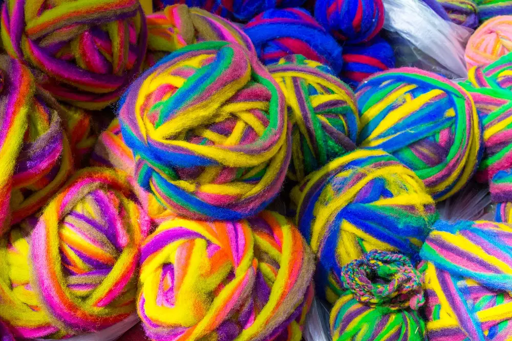 Pile of brightly coloured yarn balls
