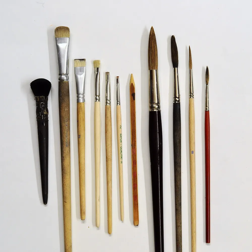 Row of paintbrushes of different sizes